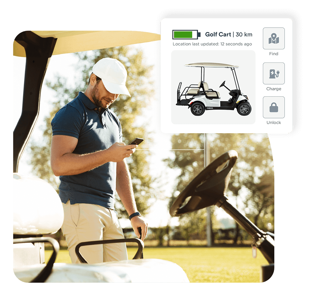 Man with a smartphone displaying an electric golf cart software widget